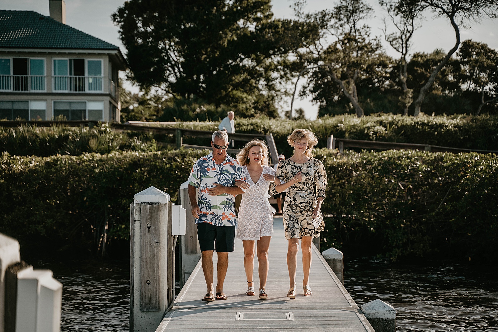 South Florida Waterfront Elopement Bride walking down captured by South Florida Elopement Photographer, Krystal Capone Photography