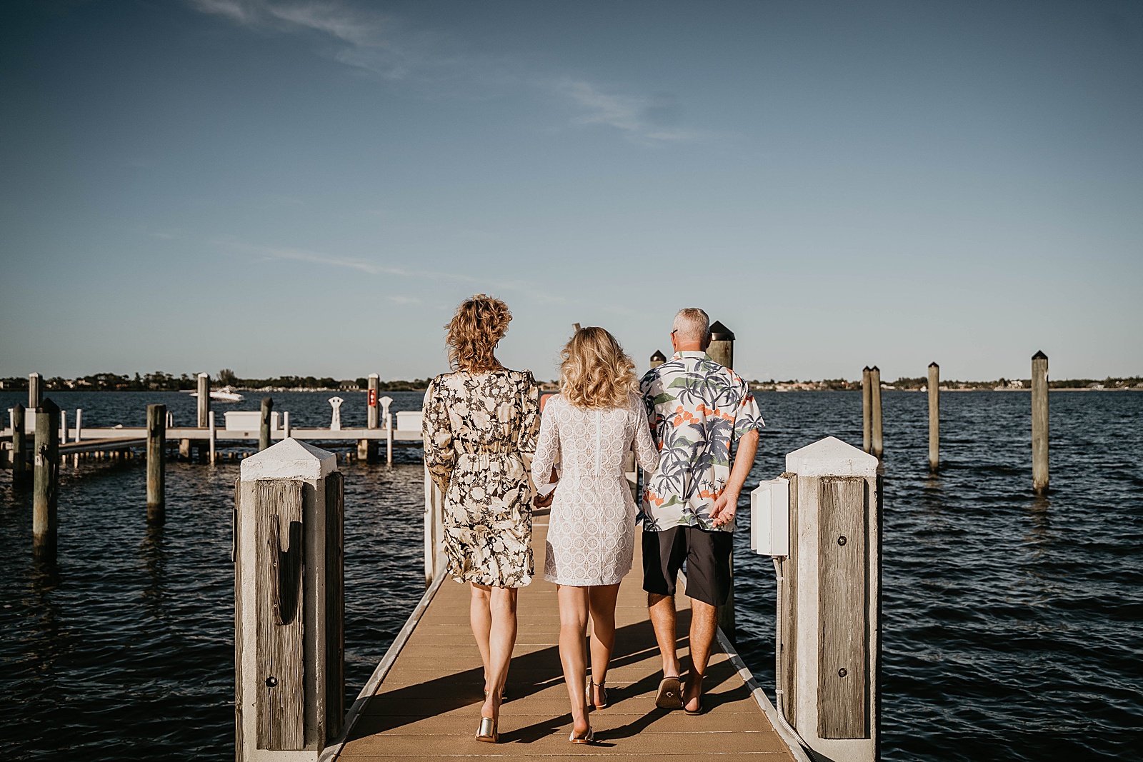 South Florida Waterfront Elopement bride walking down captured by South Florida Elopement Photographer, Krystal Capone Photography
