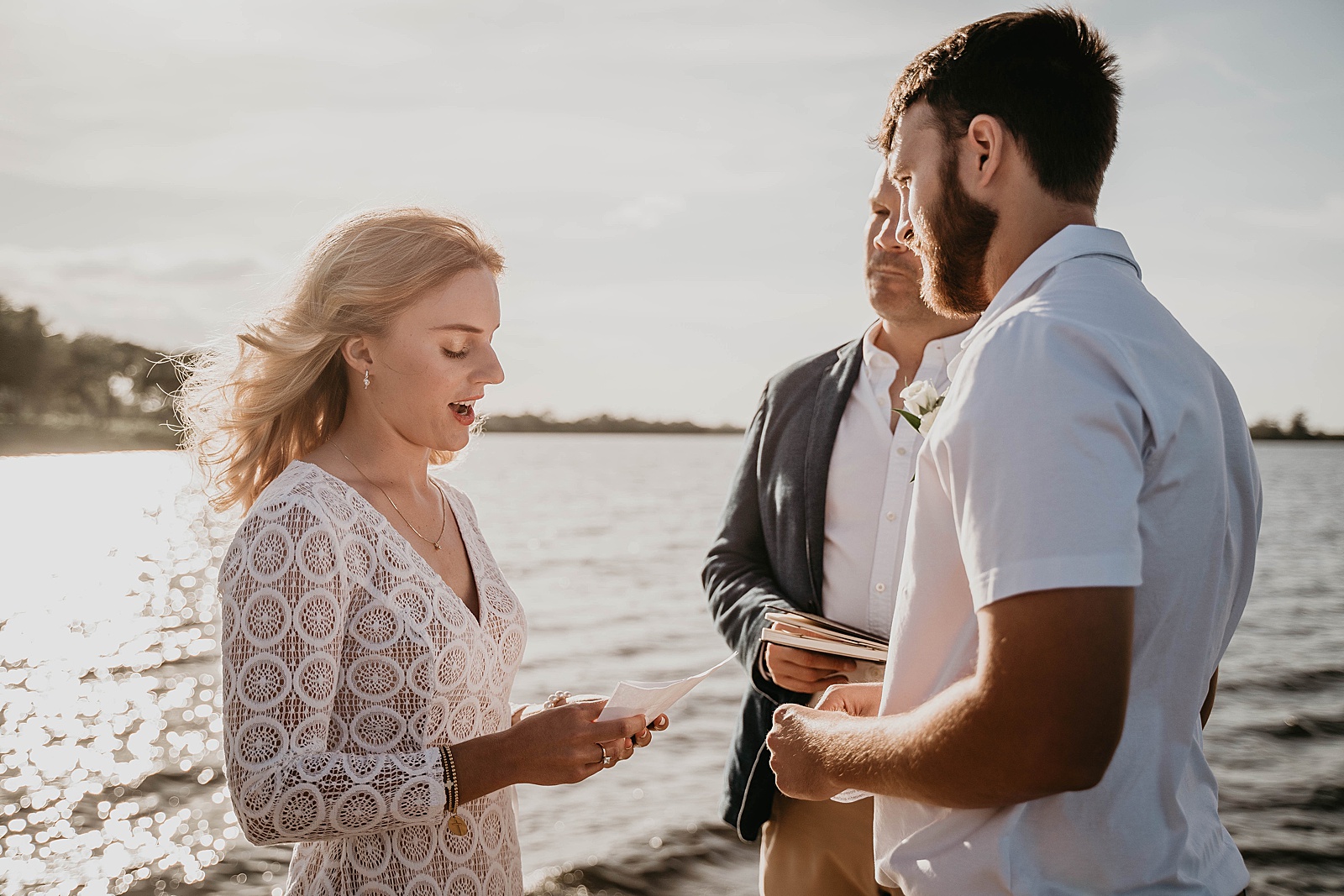 South Florida Waterfront Elopement ceremony vows captured by South Florida Elopement Photographer, Krystal Capone Photography
