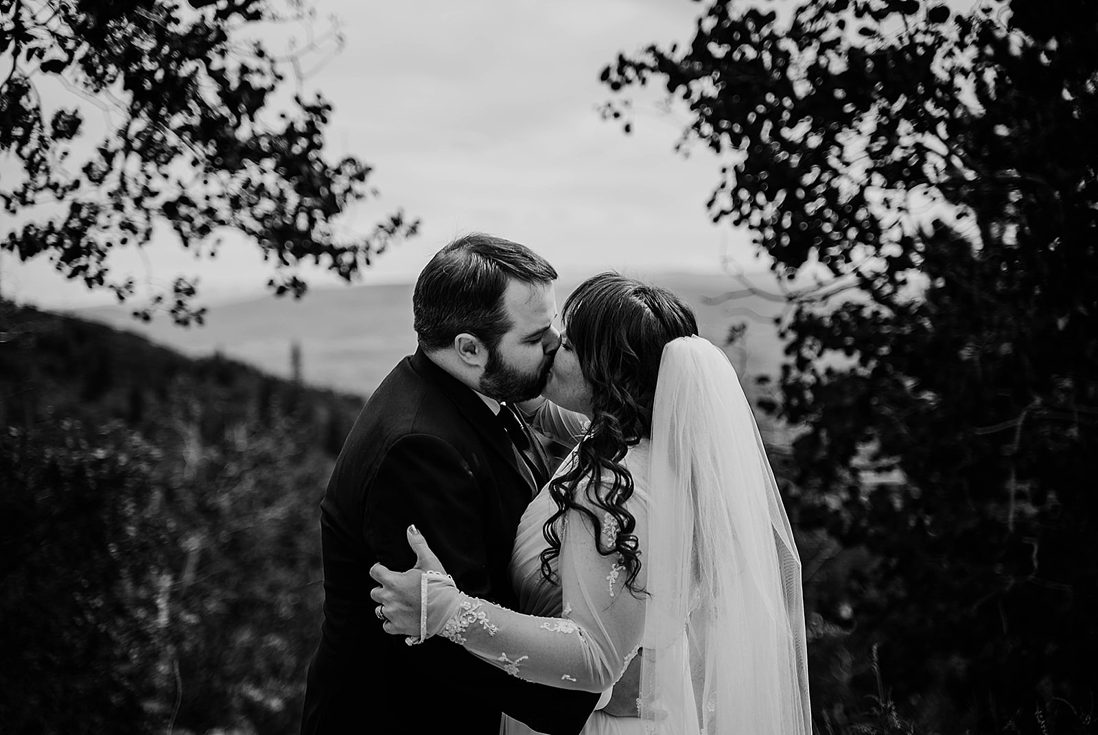 Rustic Colorado Elopement Ceremony First Kiss by Krystal Capone Photography