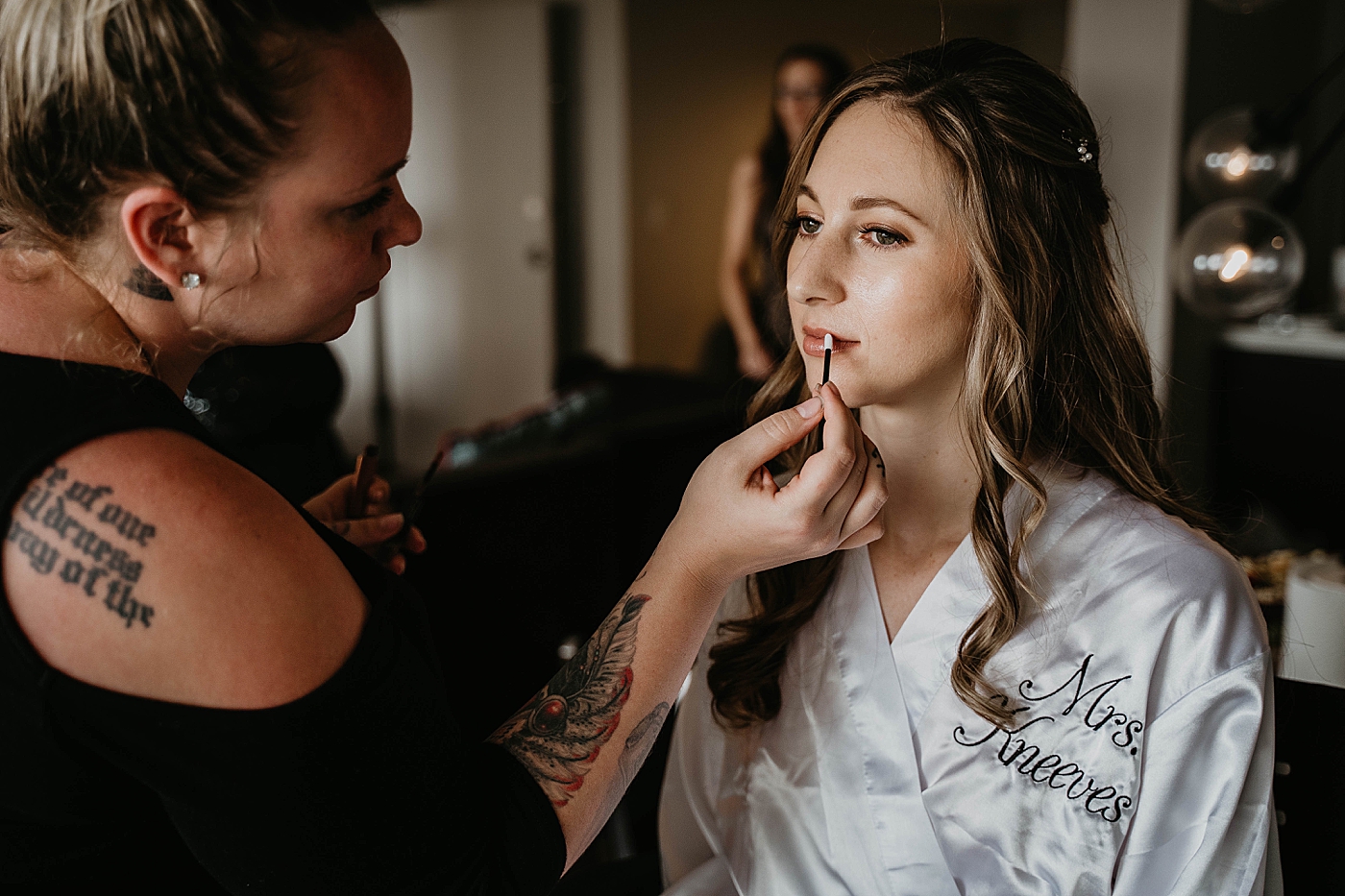 Bride getting ready putting makeup on Waterstone Resort and Marina Wedding captured by South Florida Wedding Photographer Krystal Capone Photography