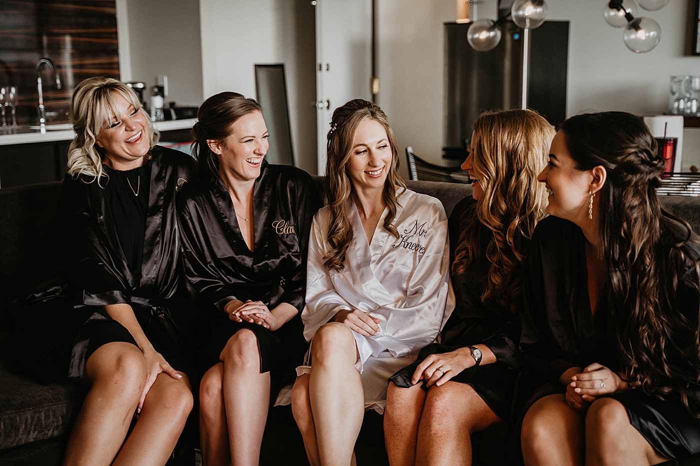 Bride getting ready with Bridemaids Waterstone Resort and Marina Wedding captured by South Florida Wedding Photographer Krystal Capone Photography