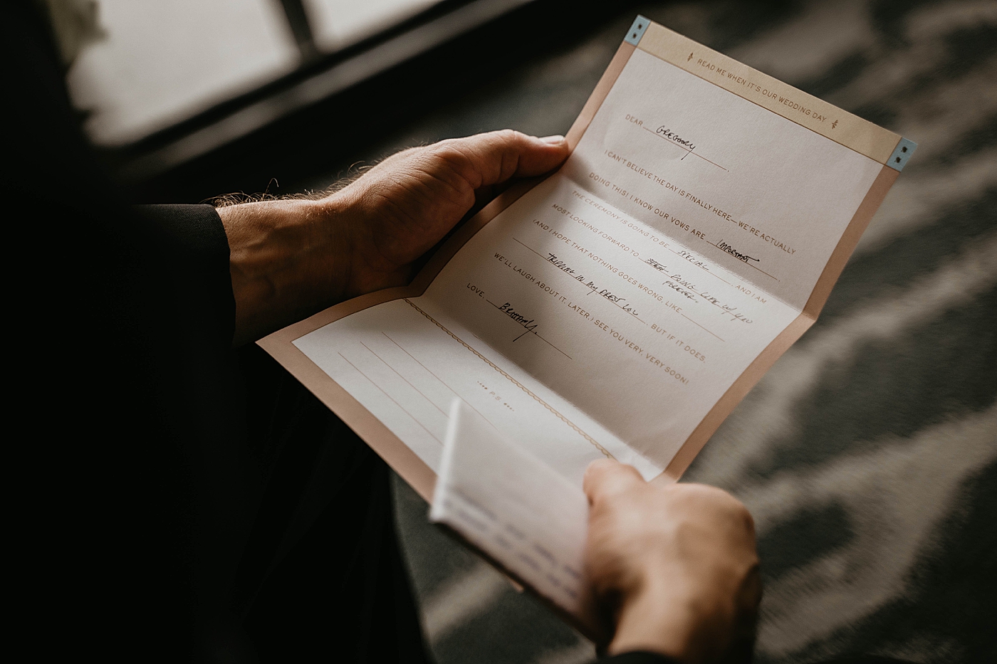 Groom reading letter from Bride detail shot Waterstone Resort and Marina Wedding captured by South Florida Wedding Photographer Krystal Capone Photography