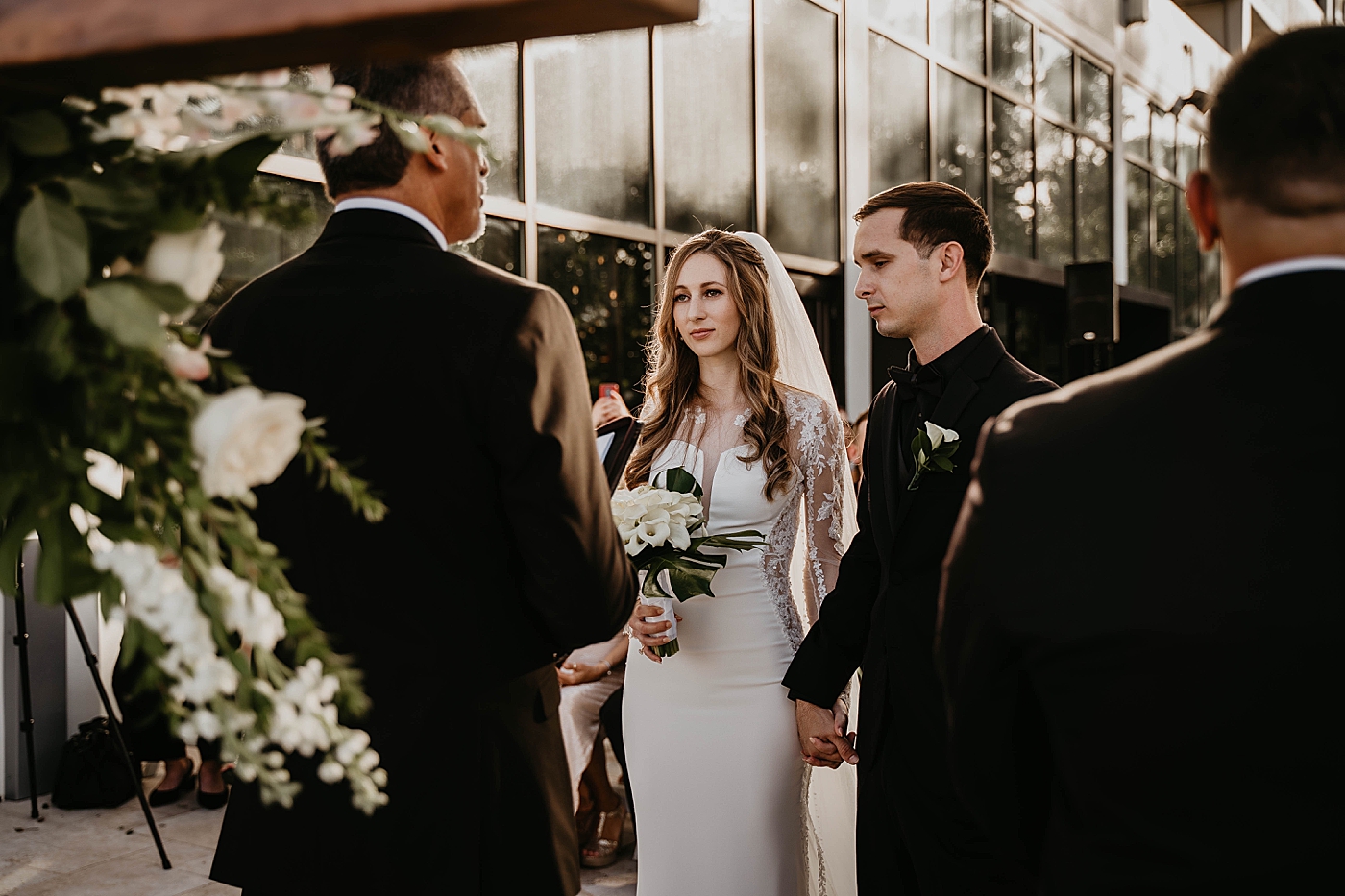 Bride and groom at the alter for Homily Waterstone Resort and Marina Wedding captured by South Florida Wedding Photographer Krystal Capone Photography