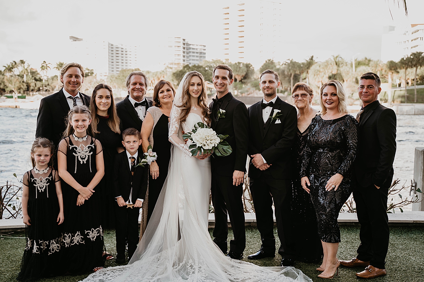 Family portraits by the ocean view Waterstone Resort and Marina Wedding captured by South Florida Wedding Photographer Krystal Capone Photography