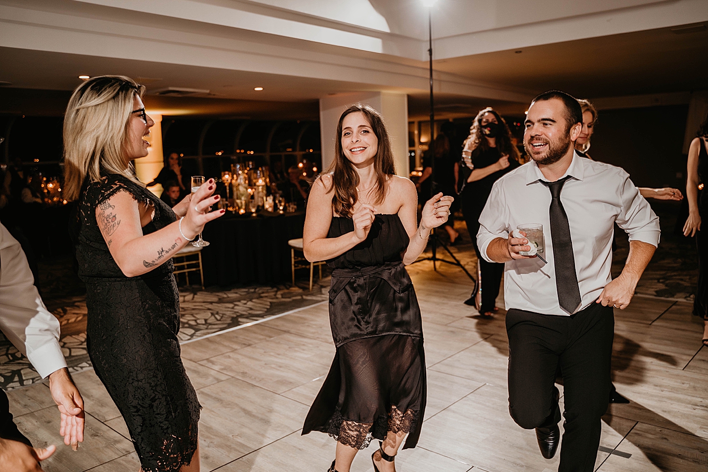 Candid dancing Reception Waterstone Resort and Marina Wedding captured by South Florida Wedding Photographer Krystal Capone Photography
