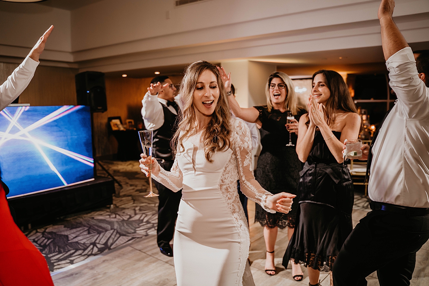 Bride dancing with Champaign Waterstone Resort and Marina Wedding captured by South Florida Wedding Photographer Krystal Capone Photography 
