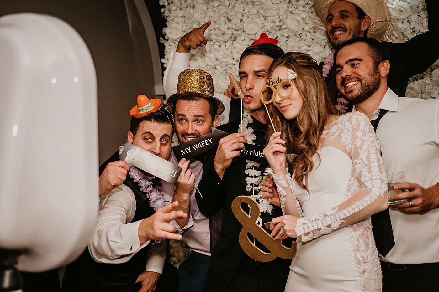 Fun Photobooth picture with decorations Waterstone Resort and Marina Wedding captured by South Florida Wedding Photographer Krystal Capone Photography