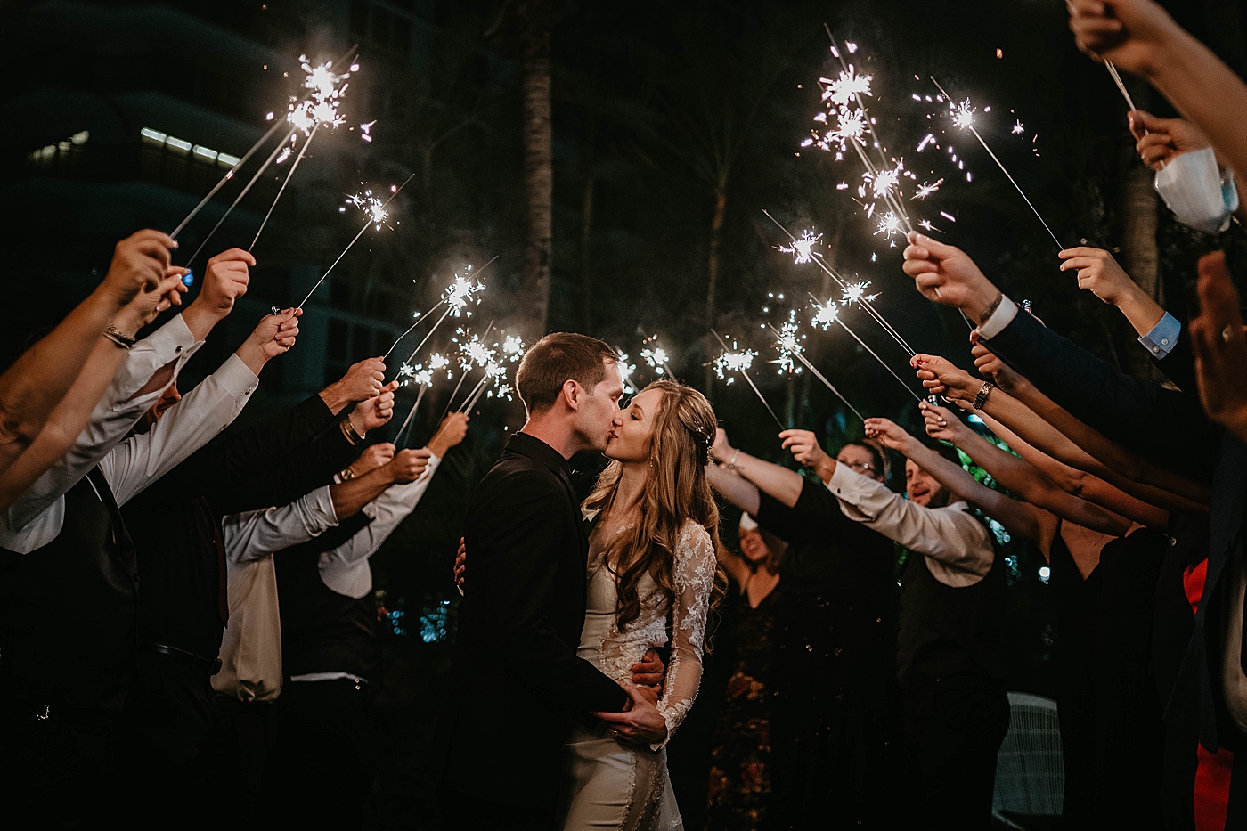 Sparkler exit kiss Waterstone Resort and Marina Wedding captured by South Florida Wedding Photographer Krystal Capone Photography
