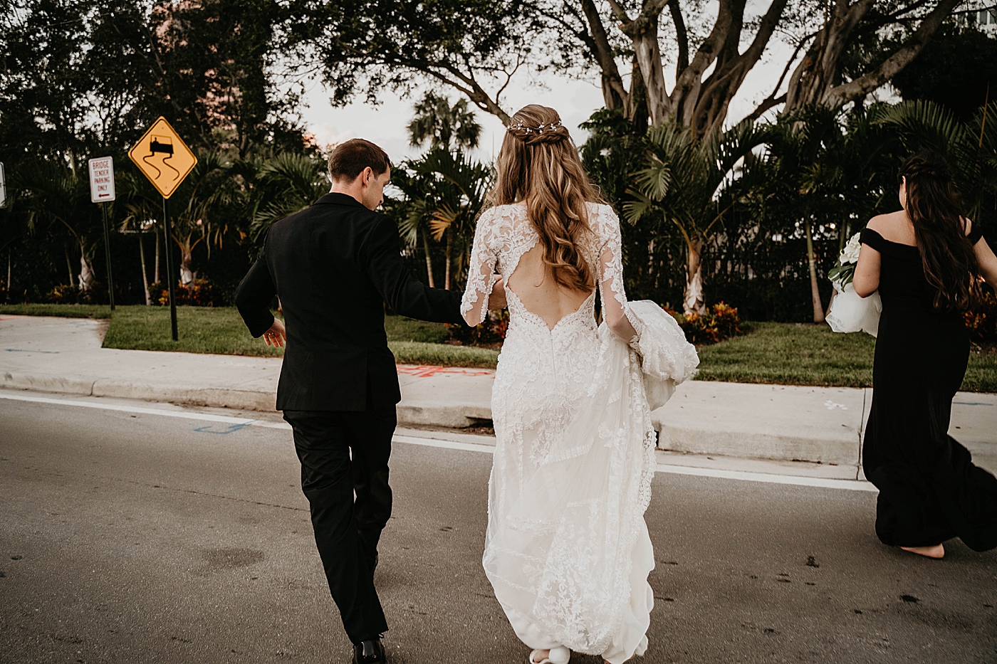 Bride and Groom preparing to enter Reception Waterstone Resort and Marina Wedding captured by South Florida Wedding Photographer Krystal Capone Photography
