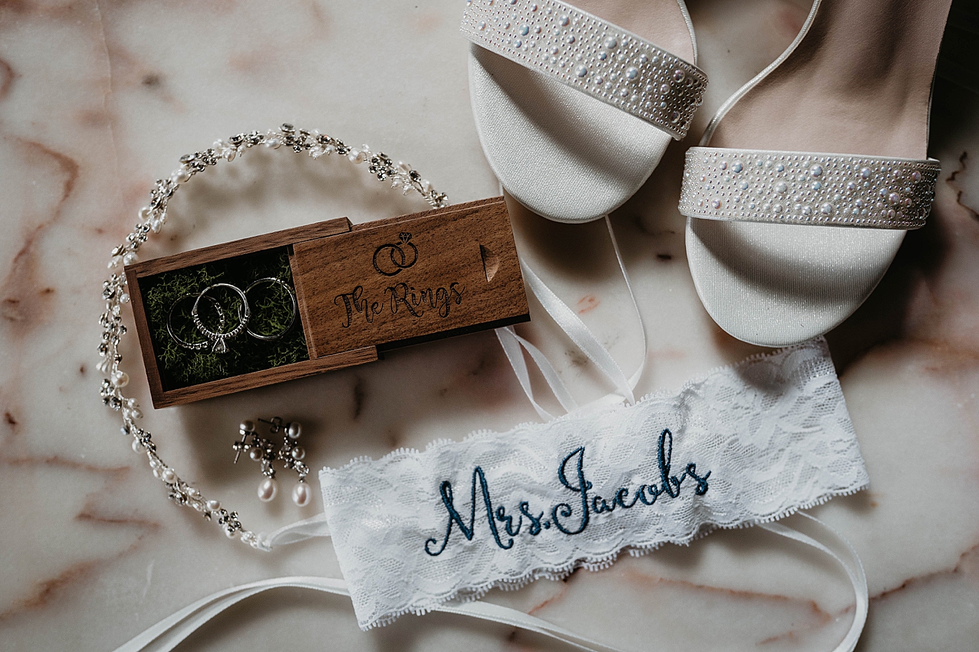 Detail shot of Wedding bands garter and heals The Estate on the Halifax Wedding Photography captured by South Florida Wedding Photographer Krystal Capone Photography 