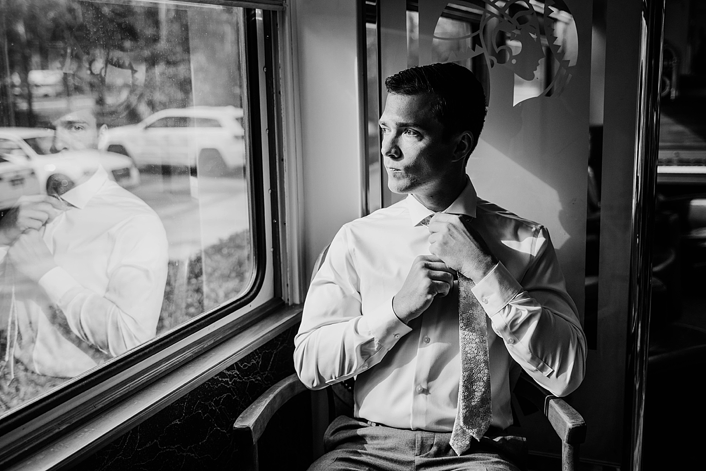 B&W of Groom putting tie on getting ready The Estate on the Halifax Wedding Photography captured by South Florida Wedding Photographer Krystal Capone Photography 