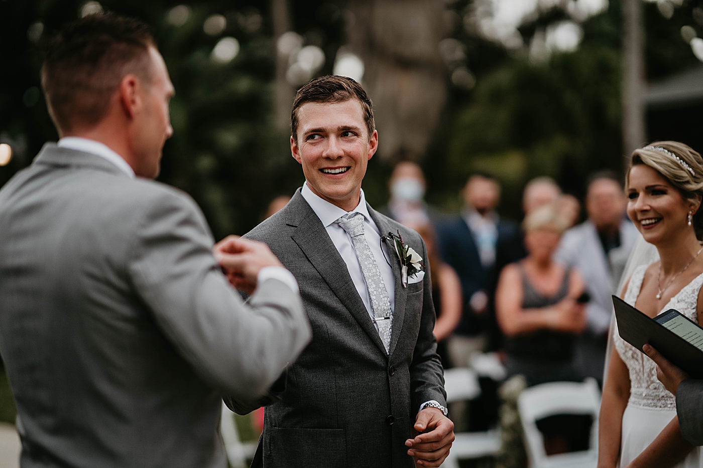 Groom looking at officiant ceremony The Estate on the Halifax Wedding Photography captured by South Florida Wedding Photographer Krystal Capone Photography 