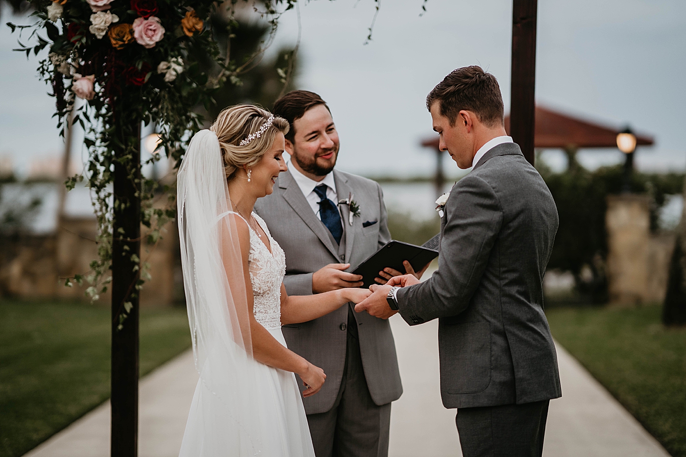 Groom putting ring on Bride The Estate on the Halifax Wedding Photography captured by South Florida Wedding Photographer Krystal Capone Photography 