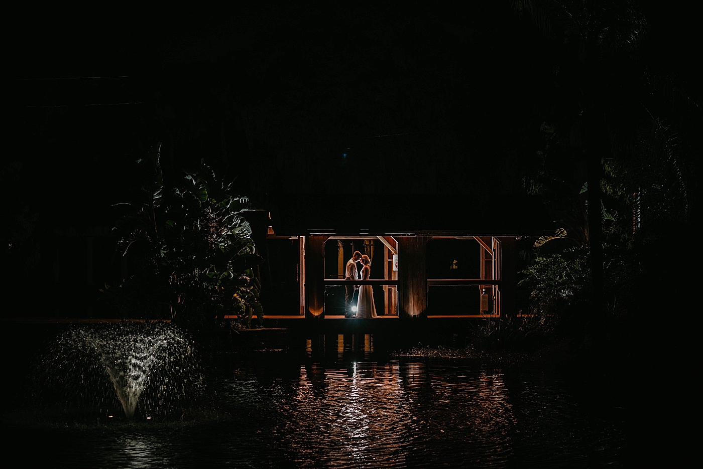 Bride and Groom distant ortrait nighttime The Estate on the Halifax Wedding Photography captured by South Florida Wedding Photographer Krystal Capone Photography 