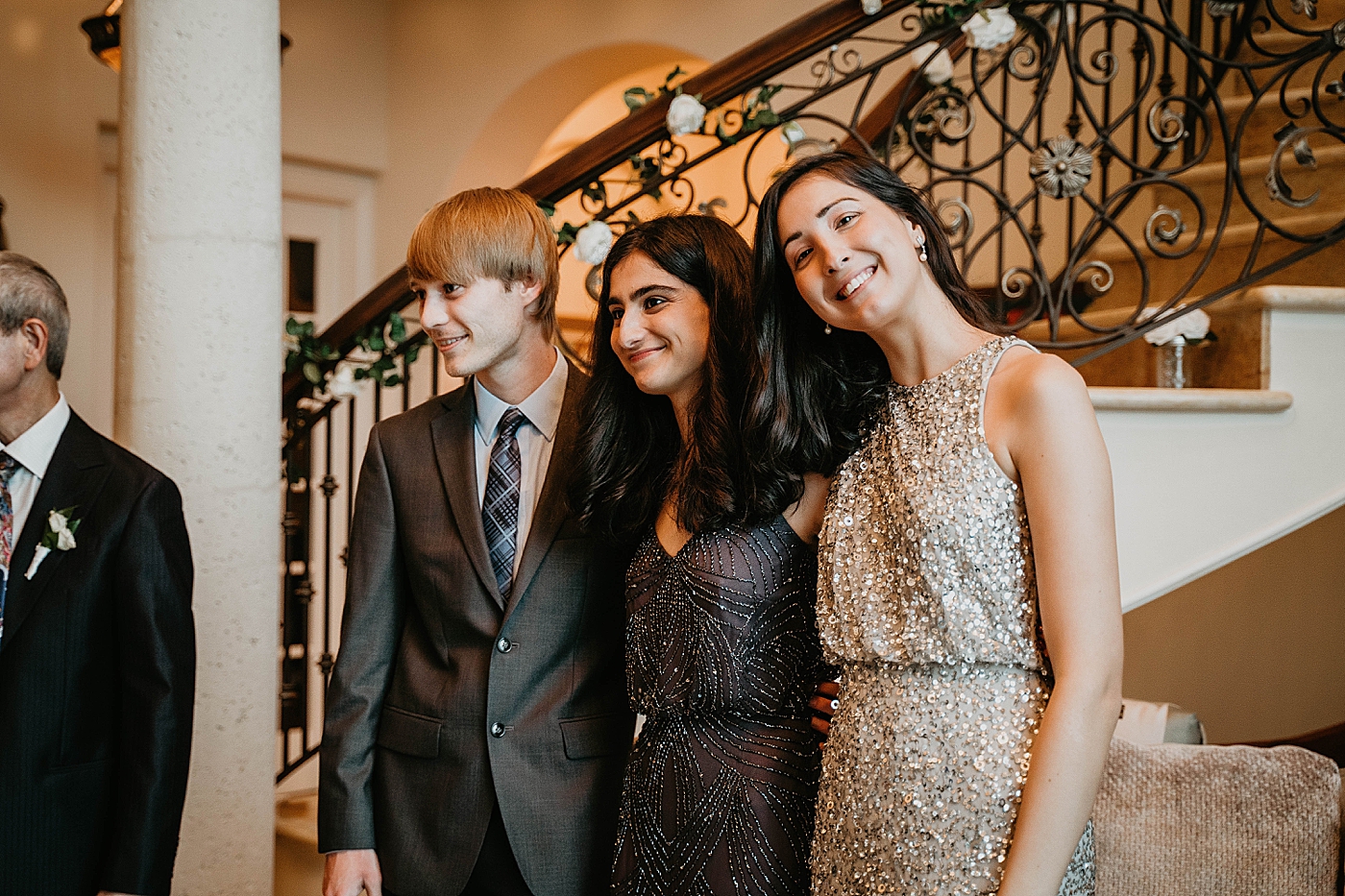 Family watching happy couple dancing Intimate Home Wedding captured by South Florida Wedding Photographer Krystal Capone Photography