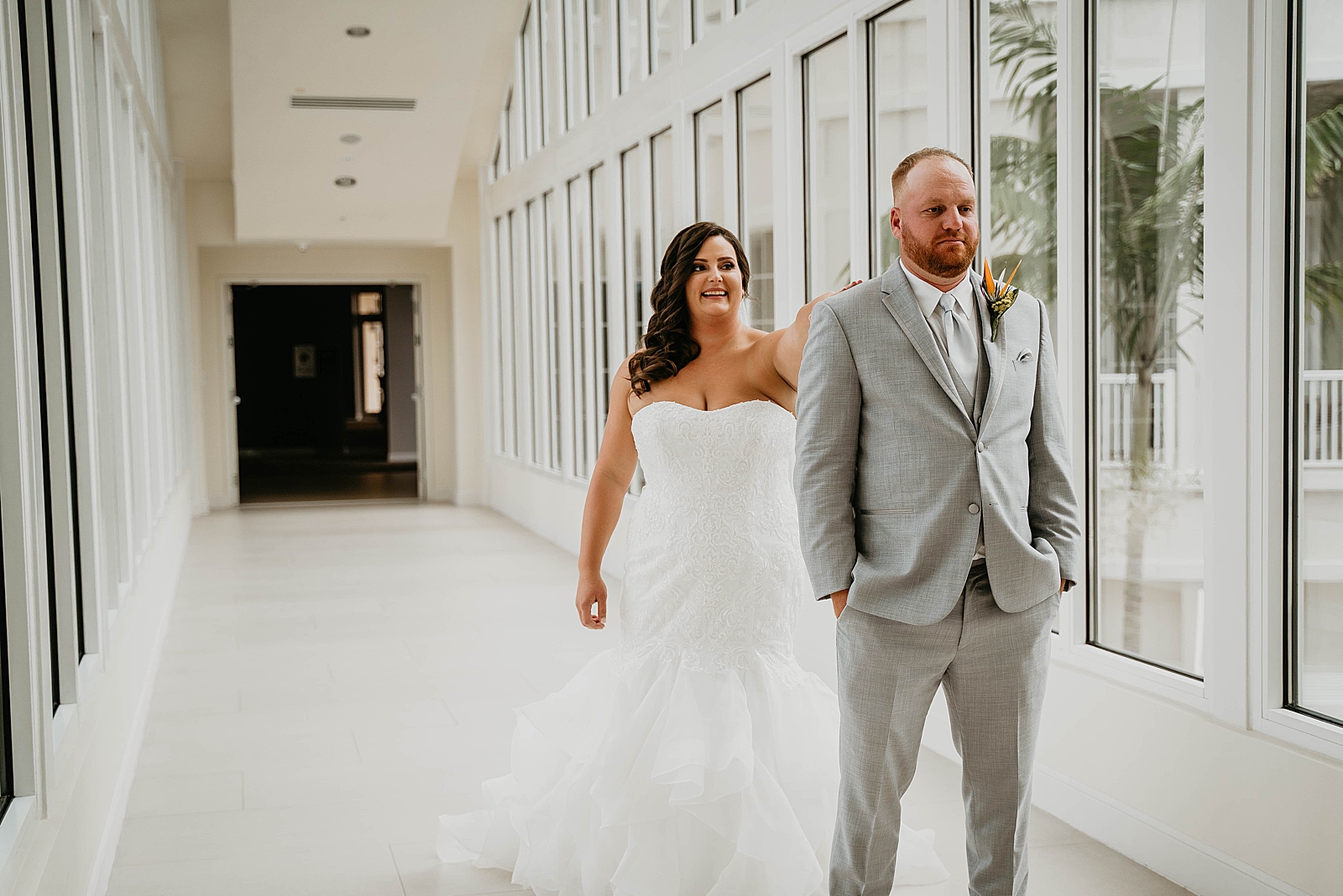 Bride tapping Groom for the First Look Jupiter Lighthouse Wedding Photography captured by South Florida Wedding Photographer Krystal Capone Photography