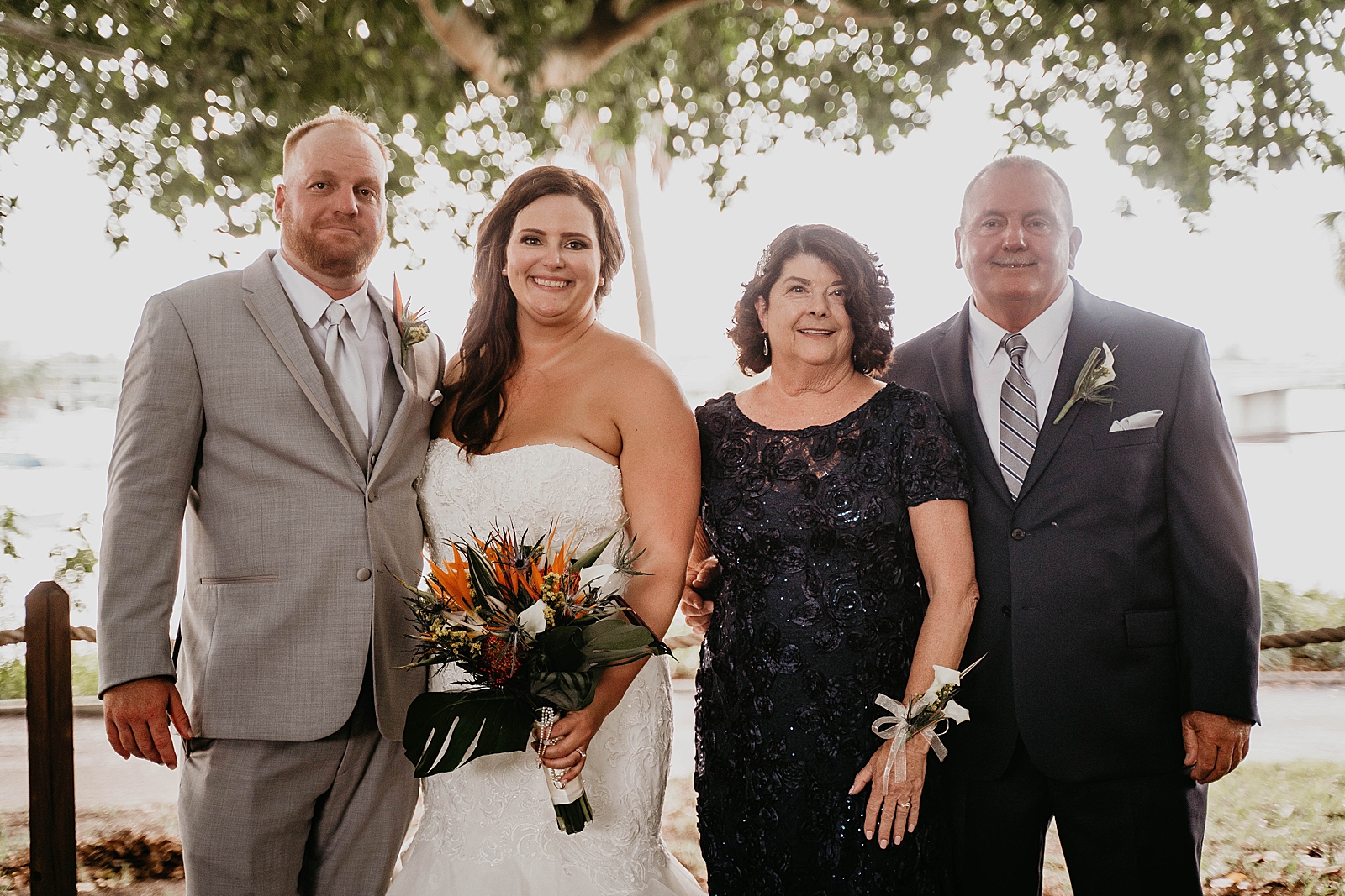 Bride and Groom family portrait Jupiter Lighthouse Wedding Photography captured by South Florida Wedding Photographer Krystal Capone Photography