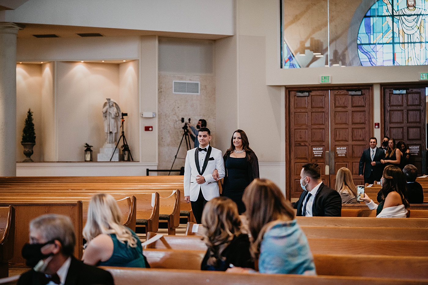 Groom entering Ceremony with Mother social distance Lavan Venue Wedding Photography captured by South Florida Wedding Photographer Krystal Capone Photography