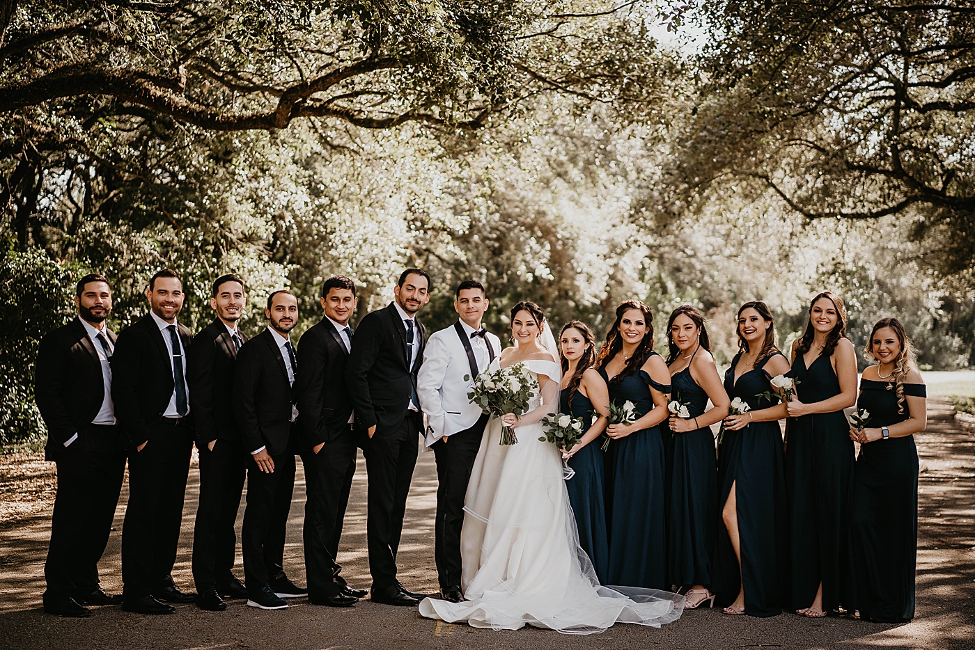 Bride and Groom with entire wedding party portrait Lavan Venue Wedding Photography captured by South Florida Wedding Photographer Krystal Capone Photography