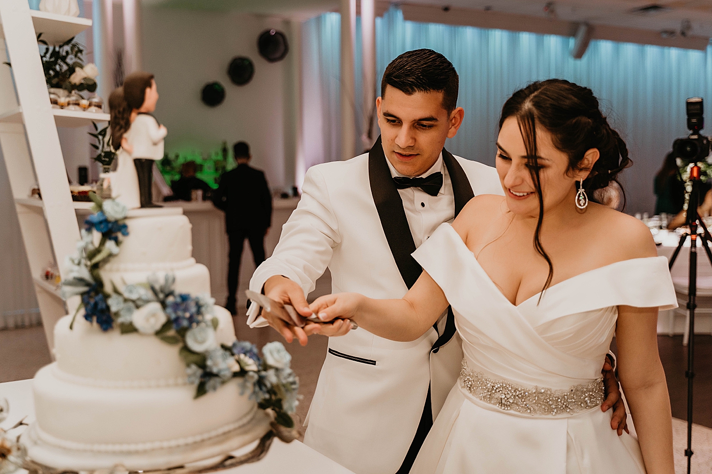 Bride and Groom cutting cake Lavan Venue Wedding Photography captured by South Florida Wedding Photographer Krystal Capone Photography