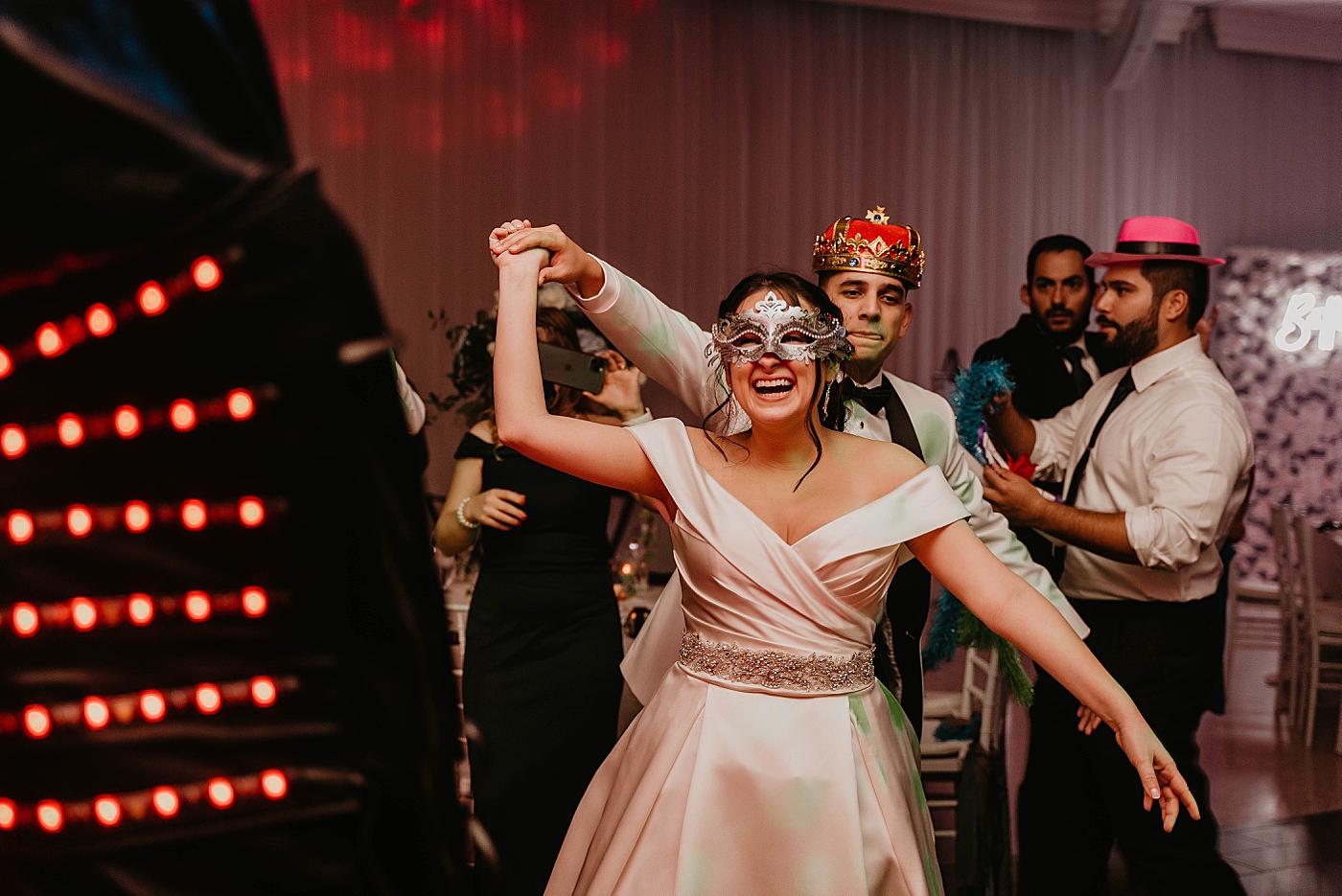 Bride and Groom dancing with fun costume decor Lavan Venue Wedding Photography captured by South Florida Wedding Photographer Krystal Capone Photography