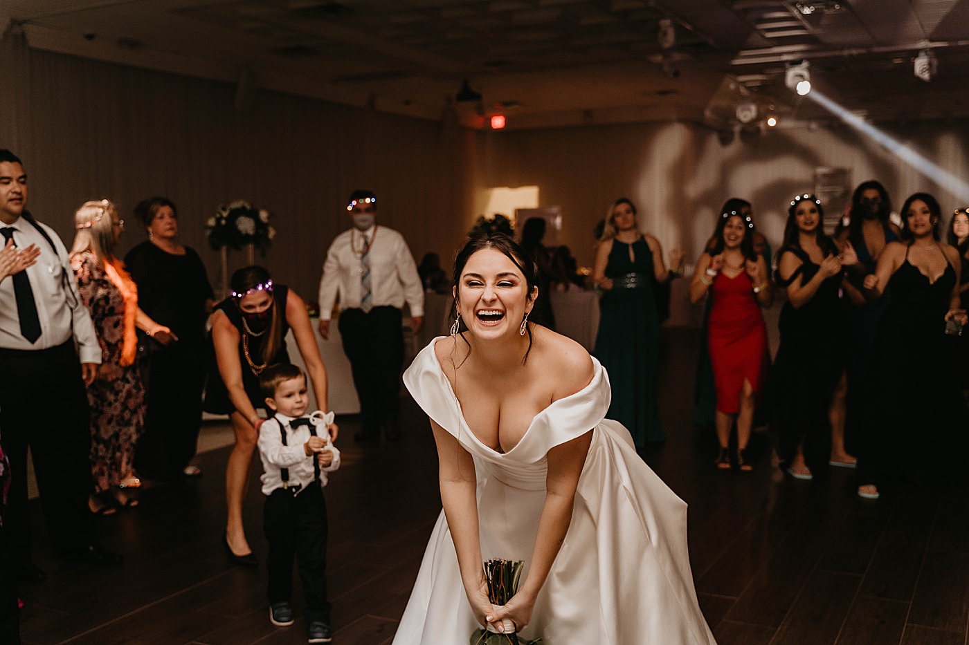 Bride about to throw Bouquet At Reception Lavan Venue Wedding Photography captured by South Florida Wedding Photographer Krystal Capone Photography