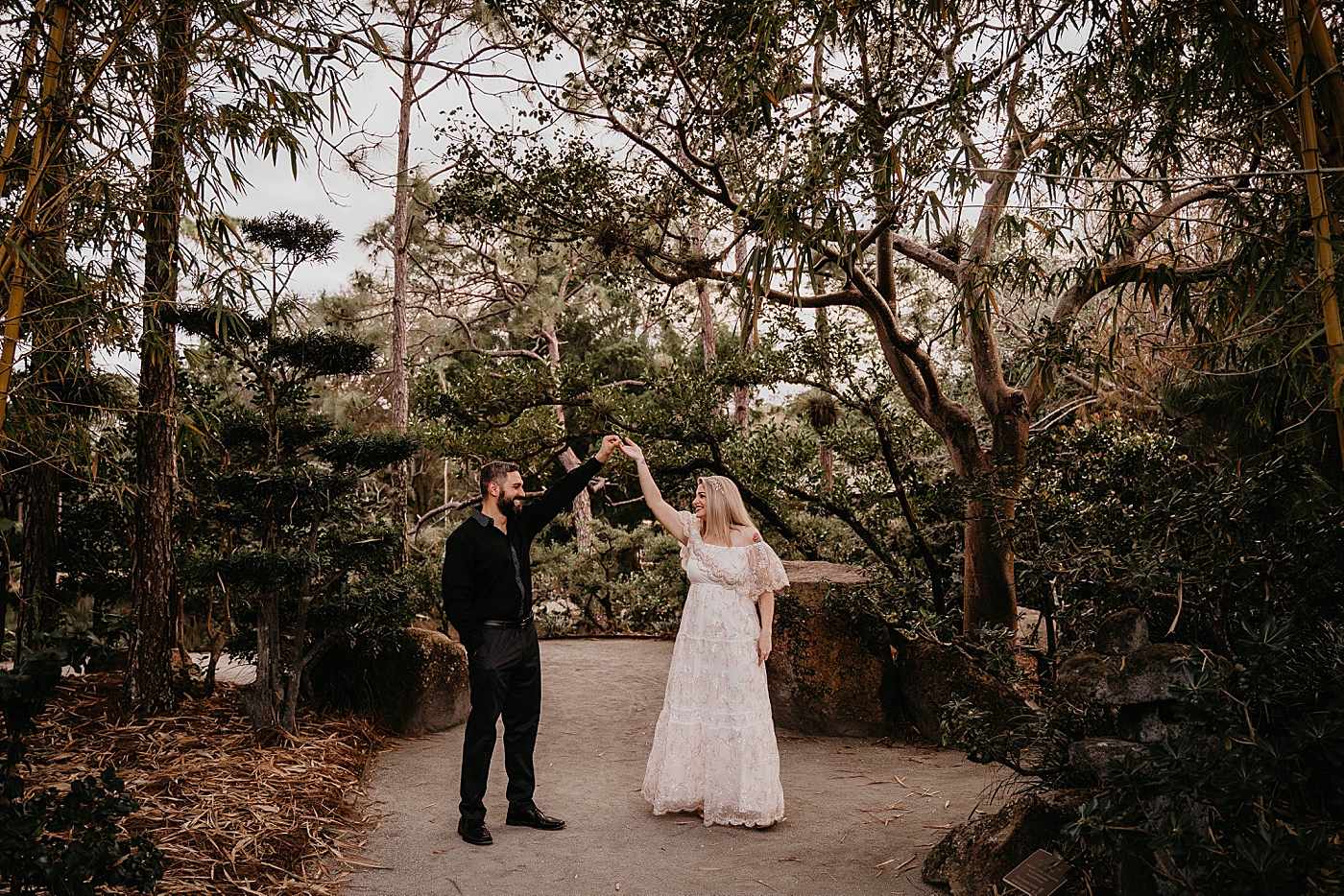 Couple posed for a pirouette Morikami Museum and Japanese Gardens Engagement Photography captured by Krystal Capone Photography