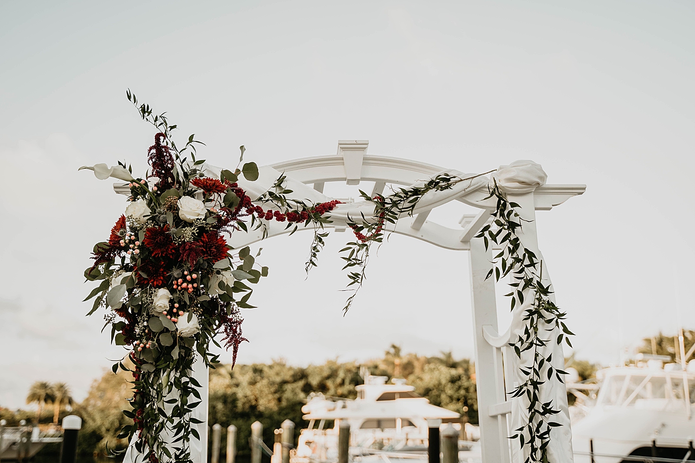 Ceremony detail shot of floral arch Out of the Blue Celebrations Wedding Photography captured by South Florida Wedding Photographer Krystal Capone Photography 