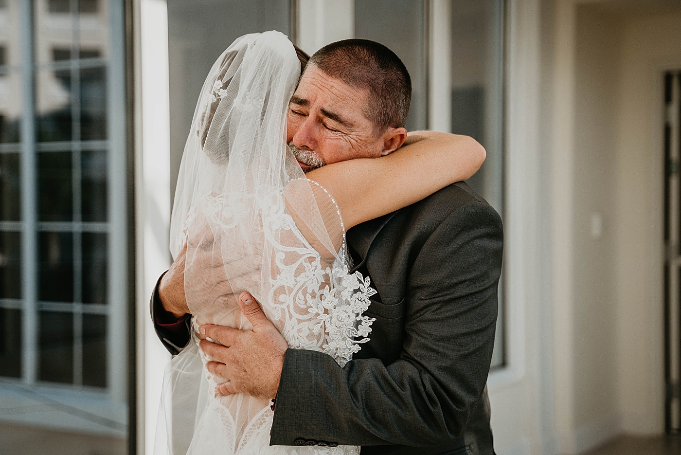 Father and Bride hugging after first look Out of the Blue Celebrations Wedding Photography captured by South Florida Wedding Photographer Krystal Capone Photography 