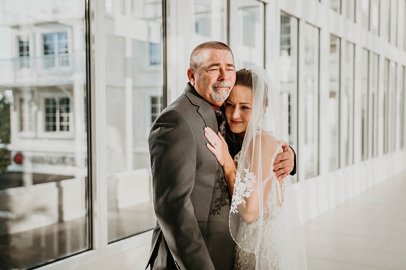 Father emotional and holding Bride after first look Out of the Blue Celebrations Wedding Photography captured by South Florida Wedding Photographer Krystal Capone Photography 
