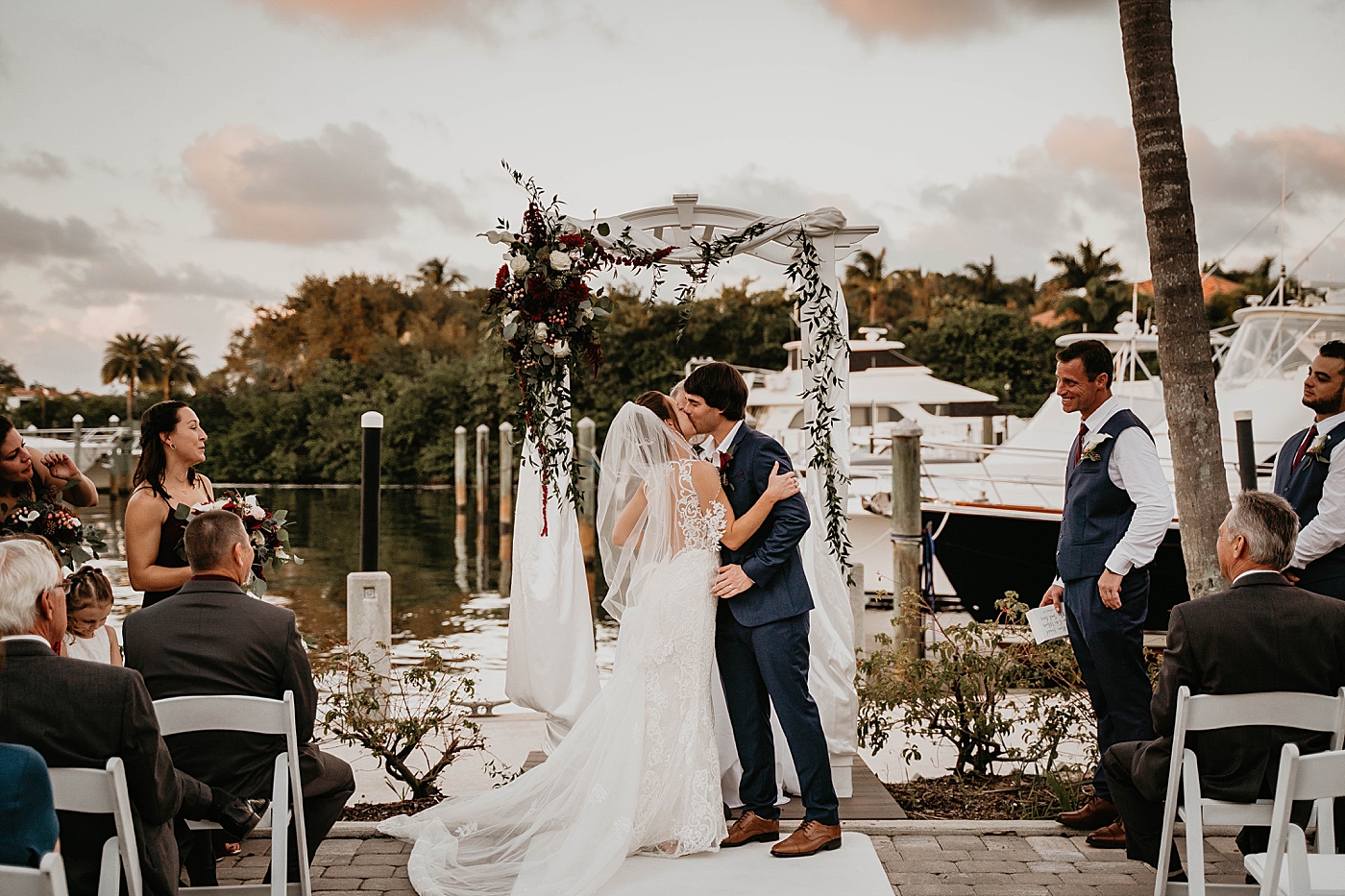 Just married Bride and Groom kissing Out of the Blue Celebrations Wedding Photography captured by South Florida Wedding Photographer Krystal Capone Photography 