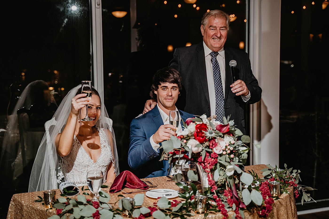 Cheers by sweetheart table Out of the Blue Celebrations Wedding Photography captured by South Florida Wedding Photographer Krystal Capone Photography 