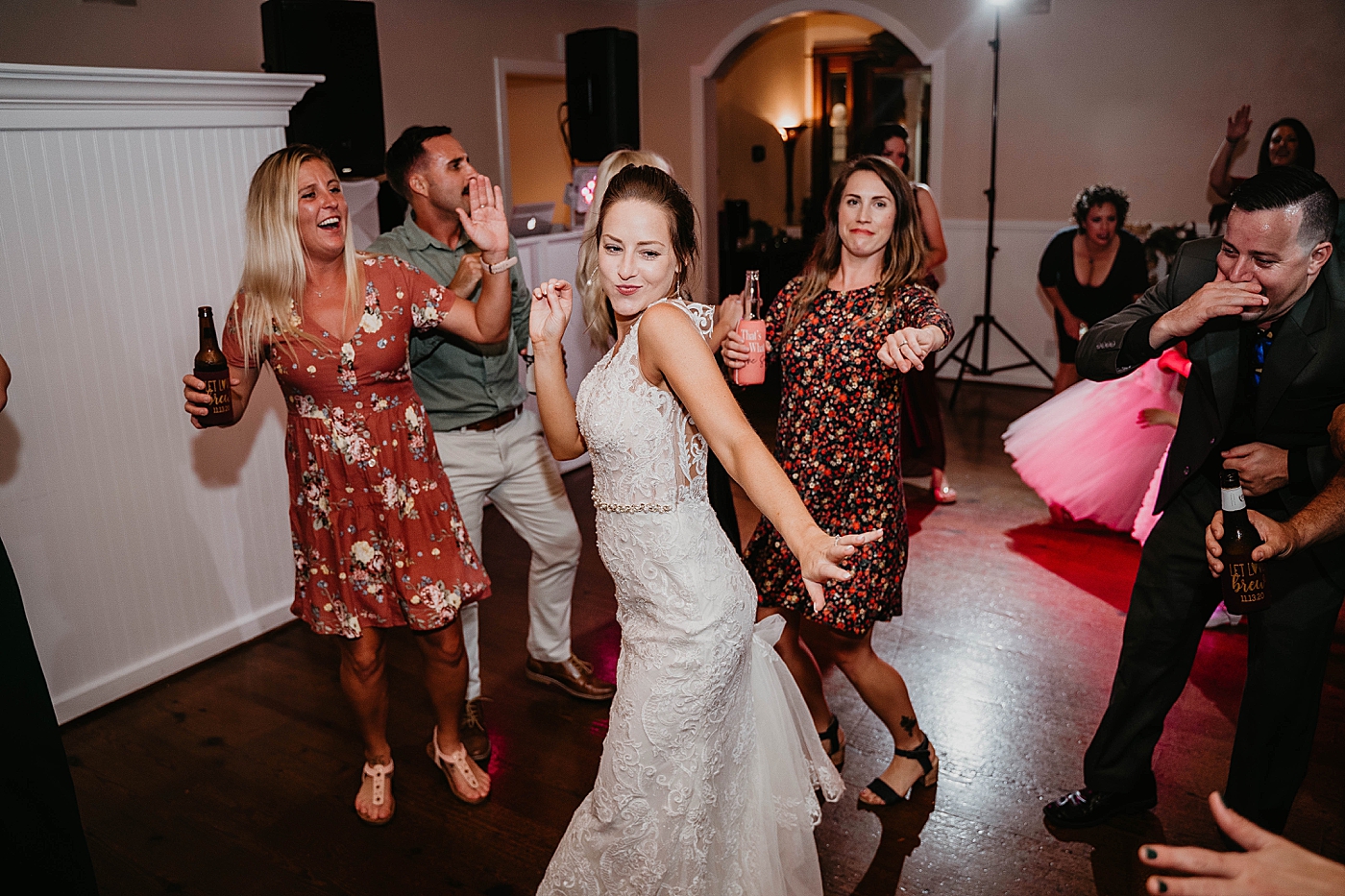 Bride having fun dancing at wedding Out of the Blue Celebrations Wedding Photography captured by South Florida Wedding Photographer Krystal Capone Photography 