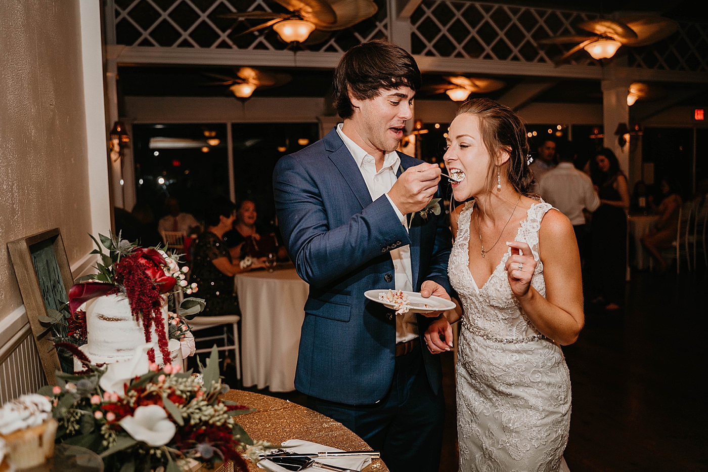 Groom feeding bite to Bride Out of the Blue Celebrations Wedding Photography captured by South Florida Wedding Photographer Krystal Capone Photography 