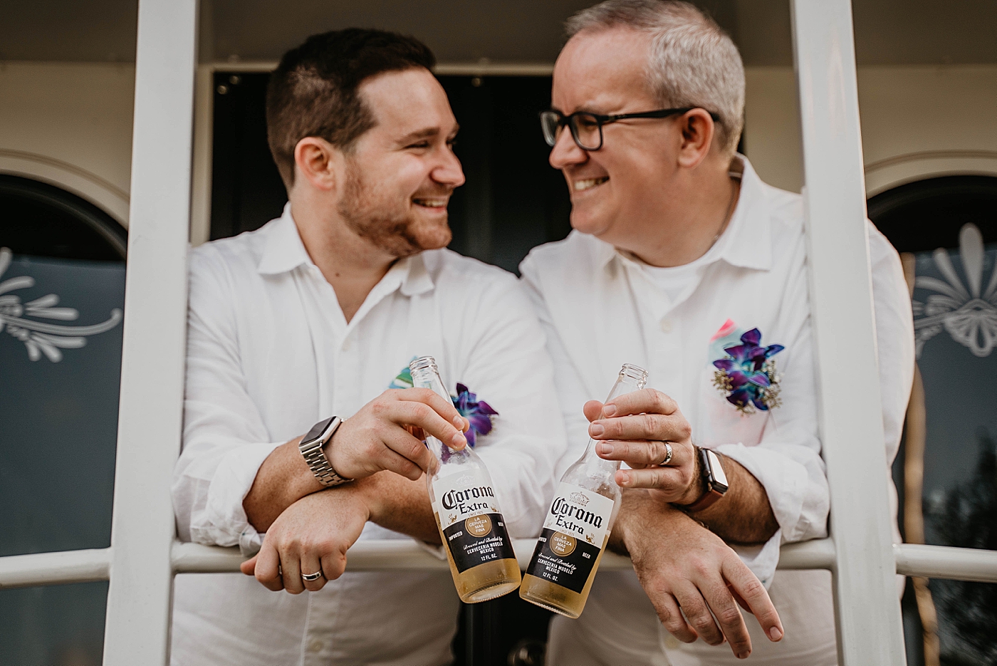 Grooms cheering Coronas on trolley Palm Beach Elopement Photography captured by South Florida Photographer Krystal Capone Photography 