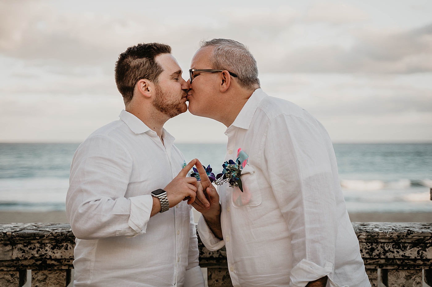 Couple kissing by the ocean Palm Beach Elopement Photography captured by South Florida Photographer Krystal Capone Photography 