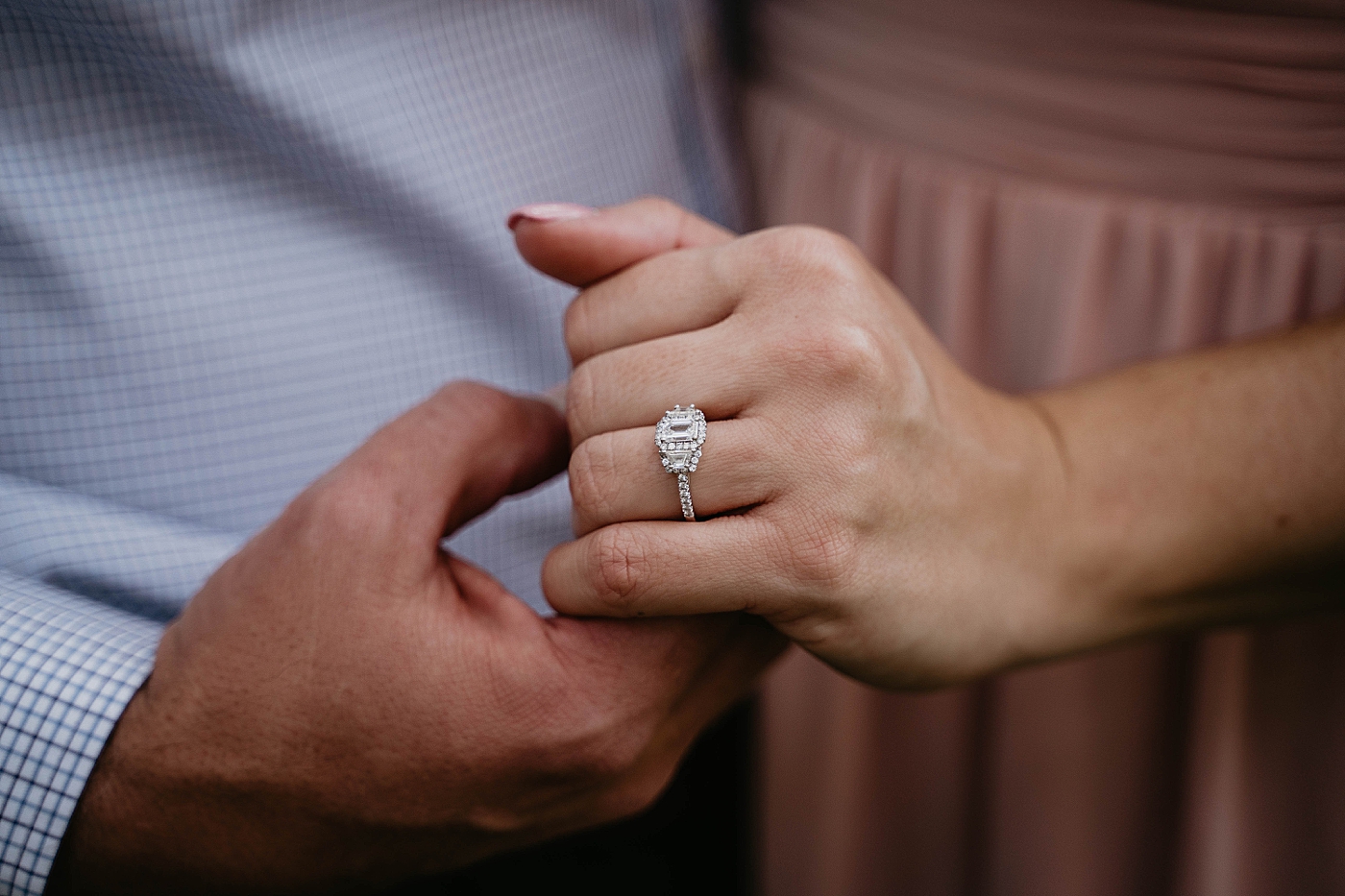 Closeup of couple holding hands with stunning engagement ring Riverbend Park Engagement Photography captured by South Florida Engagement Photographer Krystal Capone Photography