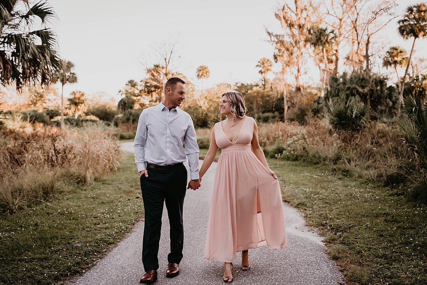 Couple holding hands and looking at each other Riverbend Park Engagement Photography captured by South Florida Engagement 