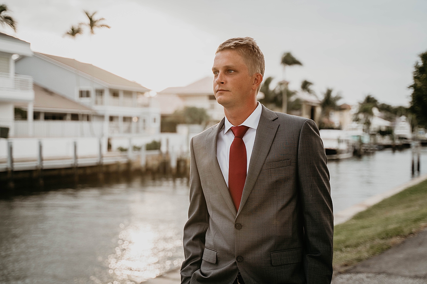 Groom by the water South Florida Elopement Photography captured by Krystal Capone Photography