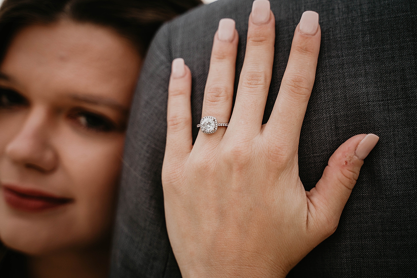 Bride holding groom in shot showing off diamond engagement ring South Florida Elopement Photography captured by Krystal Capone Photography