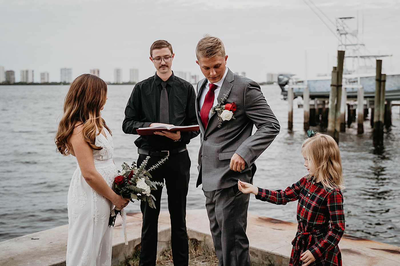 Little girl giving wedding band to groom South Florida Elopement Photography captured by Krystal Capone Photography