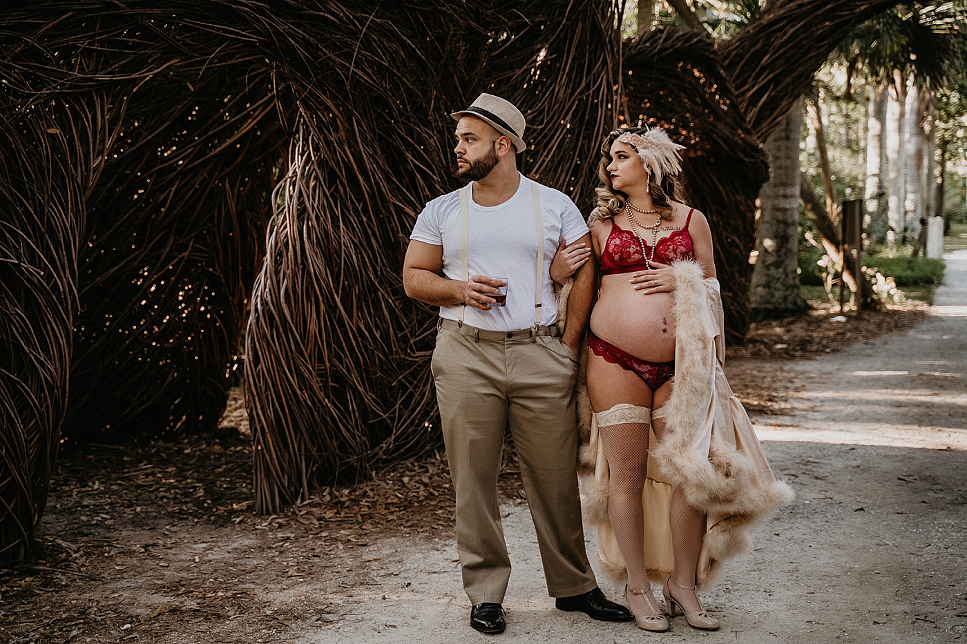 Wife holding bump and Husband's arm with husband holding drink South Florida Maternity Photography captured by South Florida Family Photographer Krystal Capone Photography 