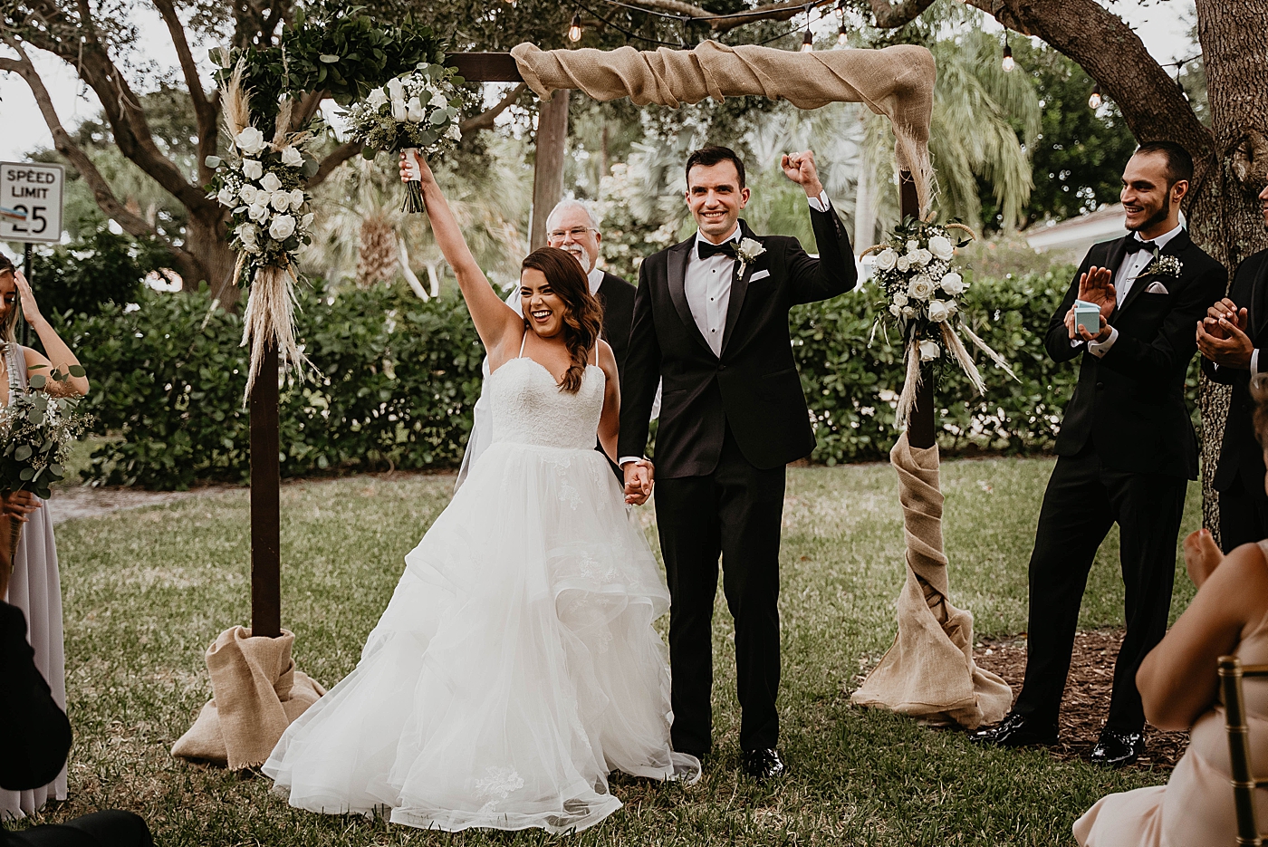 Triumphant pose going down aisle Intimate South Florida Wedding Photography captured by Wedding Photographer Krystal Capone Photography