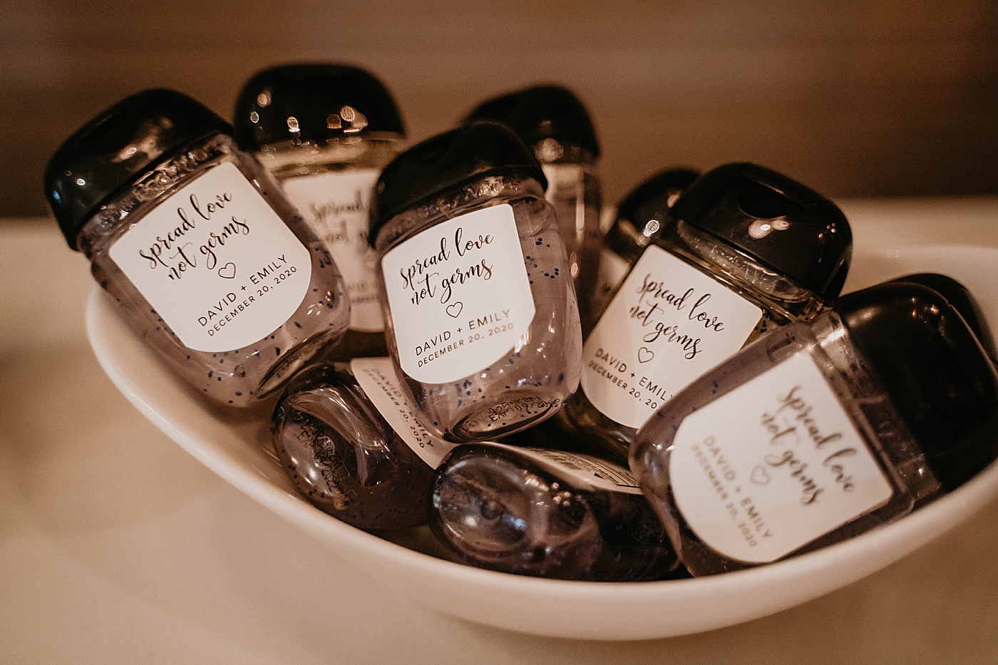 Detail shot of personalized sanitizer bottles Breakers West Wedding Photography captured by South Florida Wedding Photographer Krystal Capone Photography 