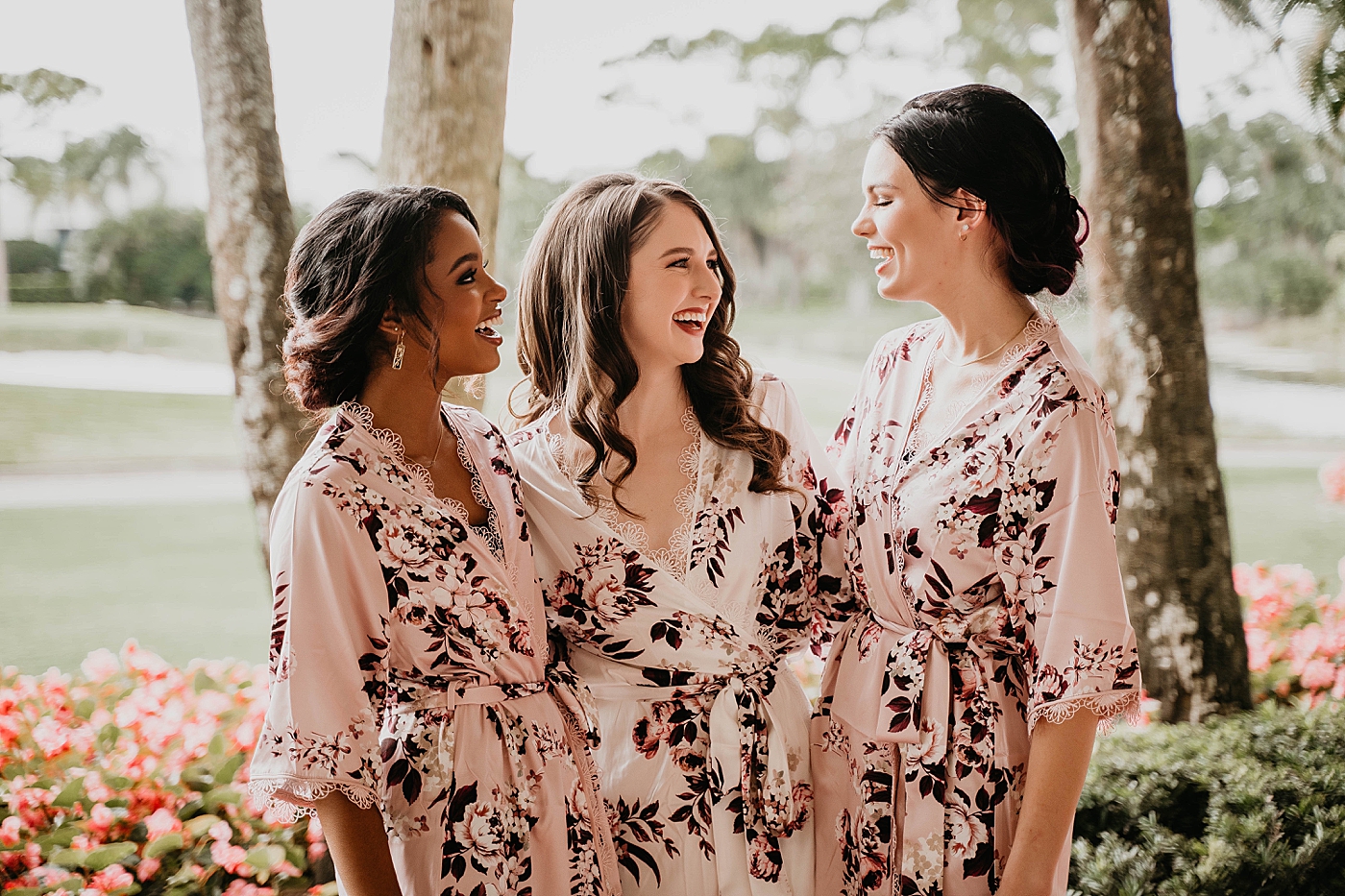 Bride with Bridesmaids getting ready with floral robes on Breakers West Wedding Photography captured by South Florida Wedding Photographer Krystal Capone Photography 