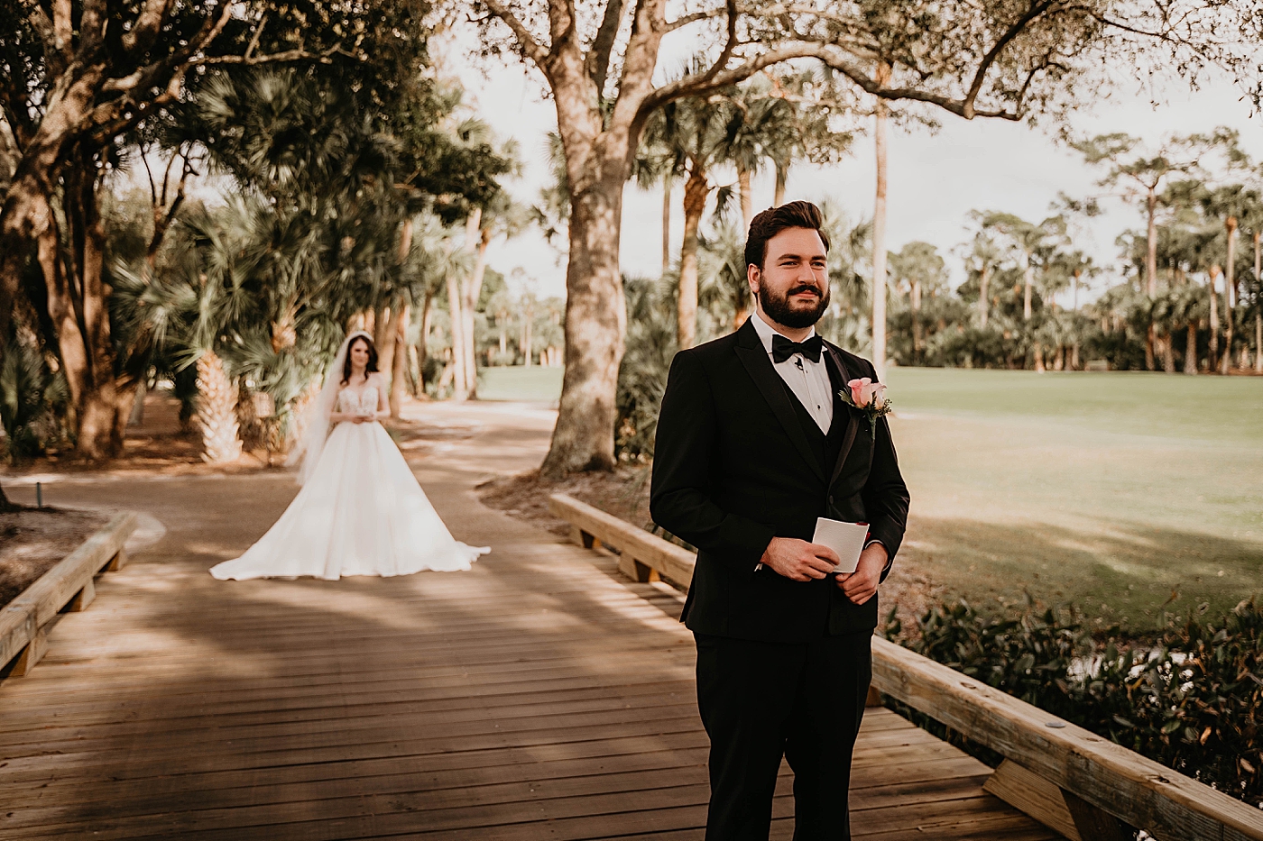 First Look with Bride approaching Groom with back turned on bridge Breakers West Wedding Photography captured by South Florida Wedding Photographer Krystal Capone Photography 