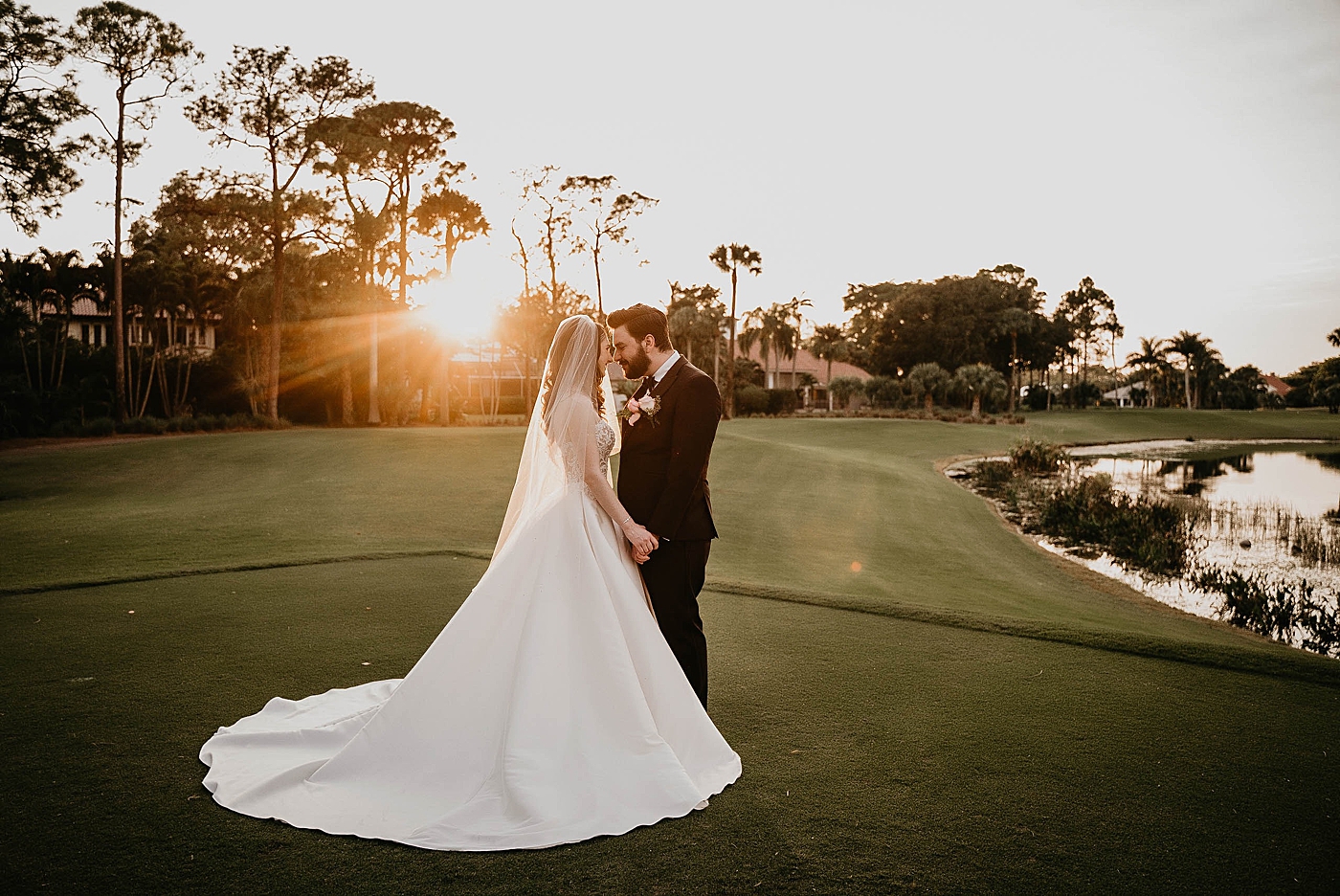 Bride and Groom nuzzling with the sun setting Breakers West Wedding Photography captured by South Florida Wedding Photographer Krystal Capone Photography 
