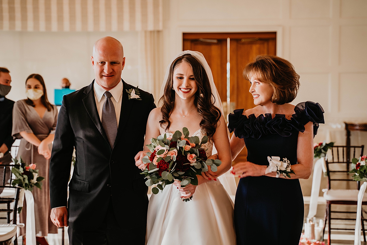 Bride entering Ceremony with mother and father Breakers West Wedding Photography captured by South Florida Wedding Photographer Krystal Capone Photography 