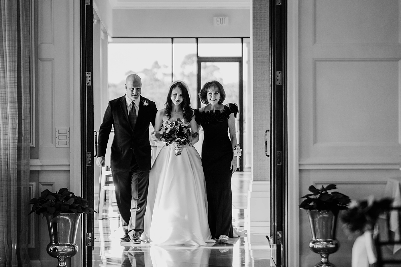 B&W Bride entering Ceremony with mother and father Breakers West Wedding Photography captured by South Florida Wedding Photographer Krystal Capone Photography 